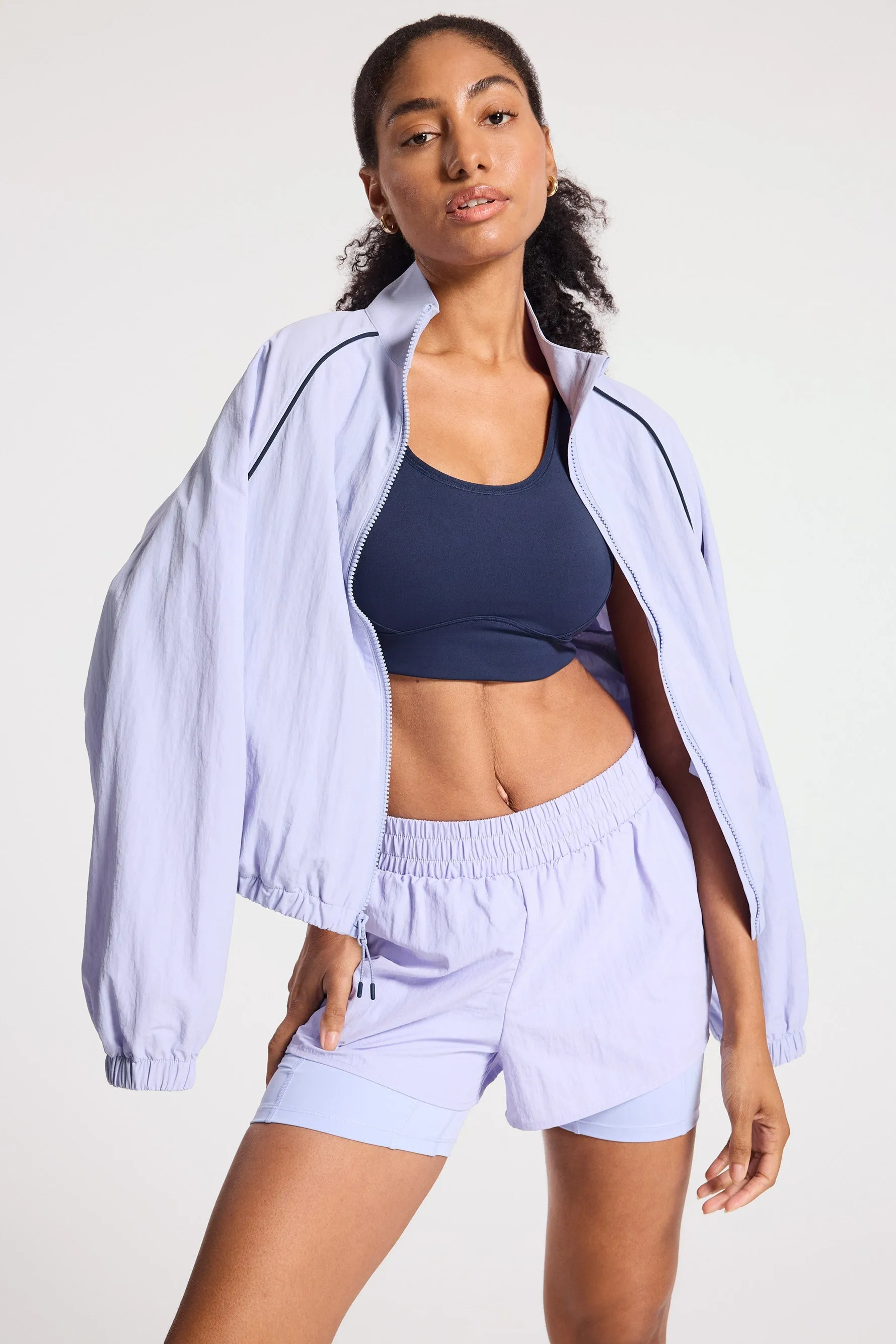 Bandier | Contrast Run Jacket | Baby Lavender/Navy Blazer