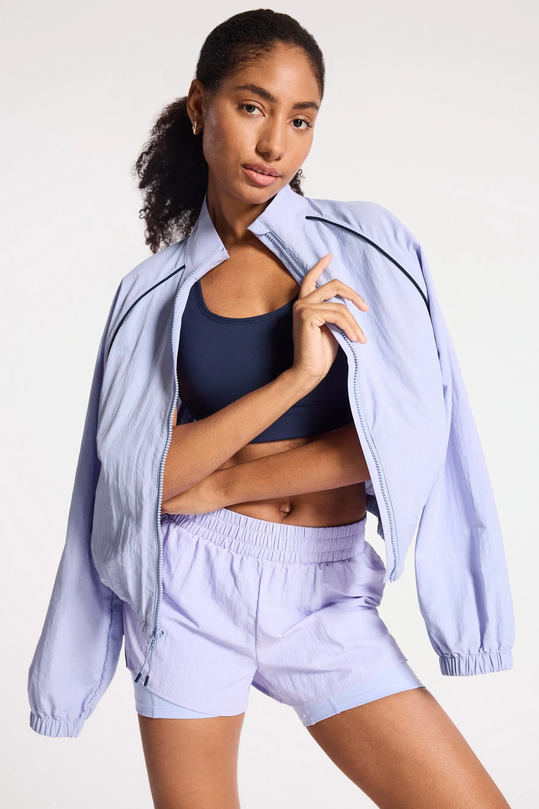 Bandier | Contrast Run Jacket | Baby Lavender/Navy Blazer