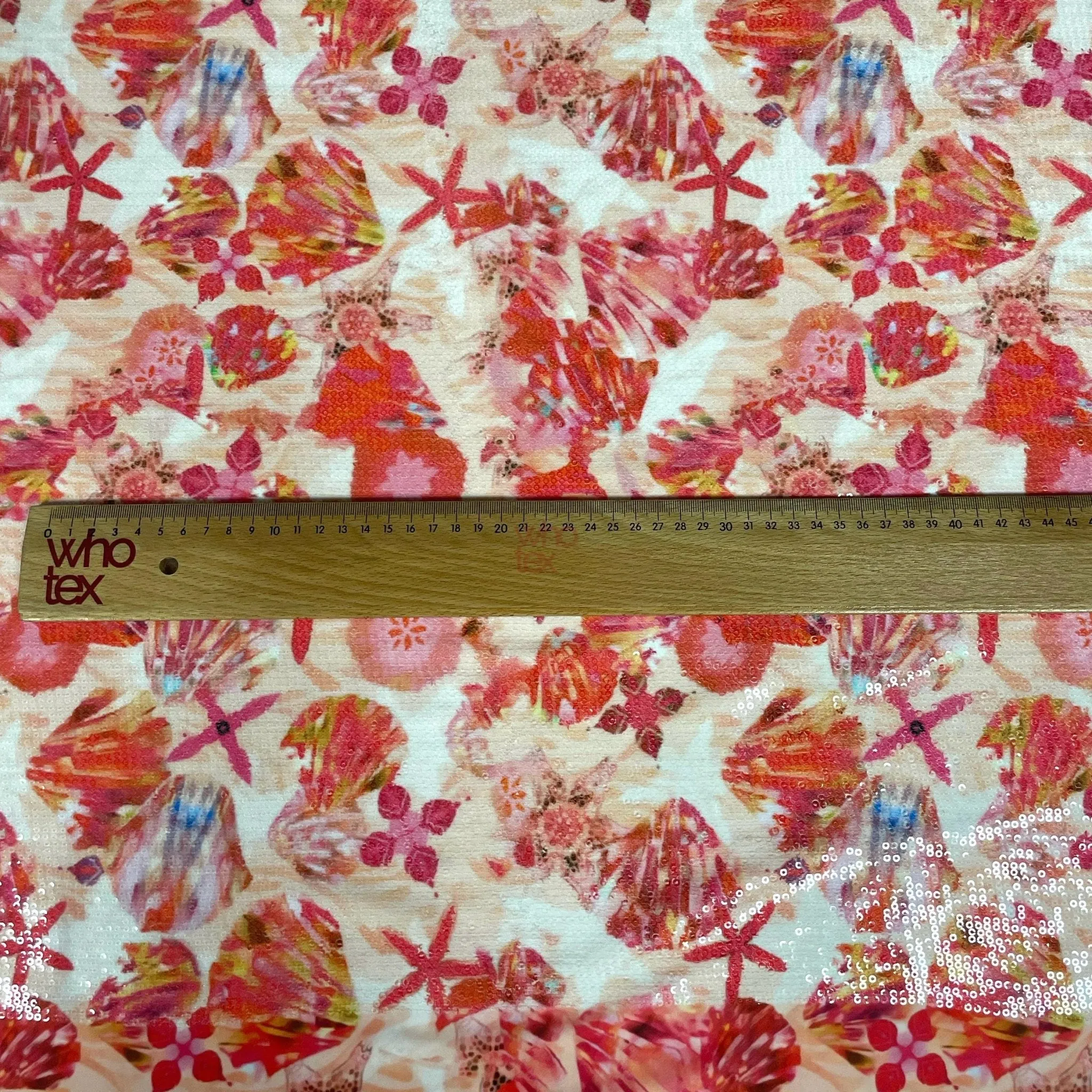 Floral Sequin Fabric – Red and Pink Starfish 2-Way Stretch Fabric By The Yard